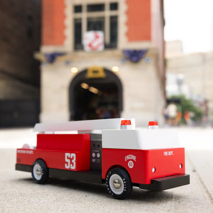 Montessori fire truck toy by Candylab, crafted from sustainable materials.