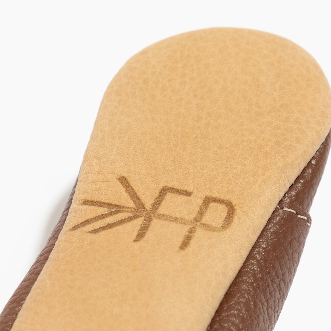 Freshly Picked Chestnut Oxford baby shoe sole logo close-up, premium leather