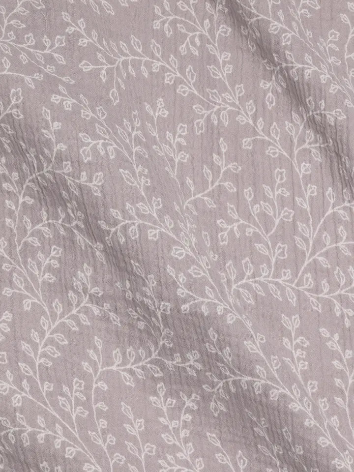 Wrap your baby in Colored Organics Organic Baby Muslin Swaddle Blanket in Lucia Floral Lilla, cozy infant swaddle blanket