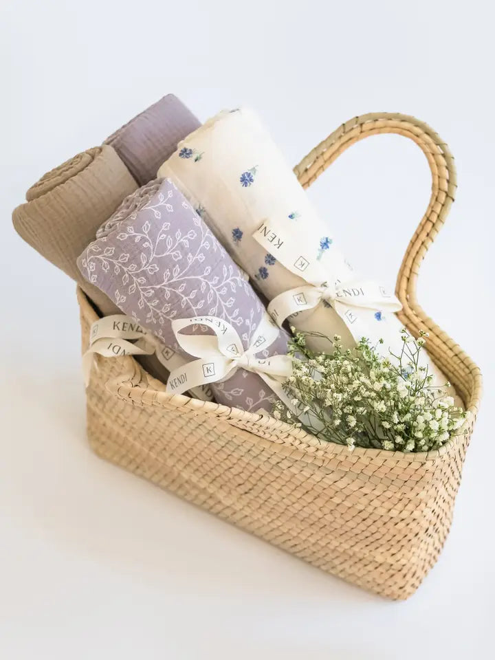 Keep little ones snug with Colored Organics Organic Baby Muslin Swaddle Blanket in Lucia Floral Lilla, breathable muslin swaddle blanket