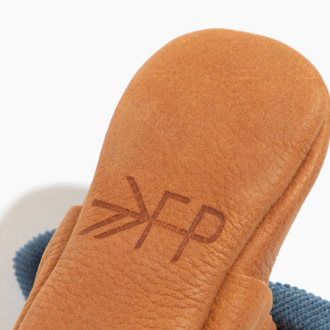 Freshly Picked Corduroy Cowgirl Knotted Bow baby shoe sole logo close-up, premium leather