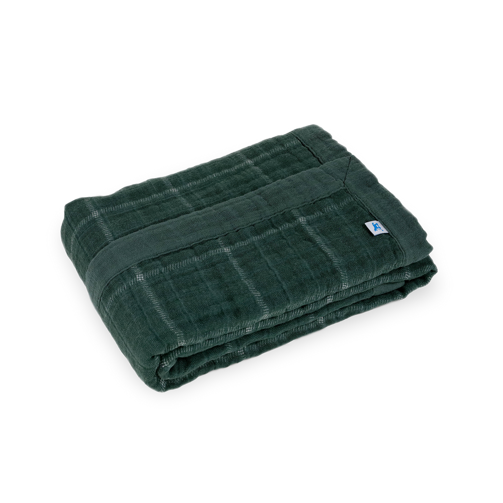 Close-up of Little Unicorn Cotton Muslin Baby Quilt - Evergreen Plaid showing soft, breathable muslin fabric for everyday comfort.