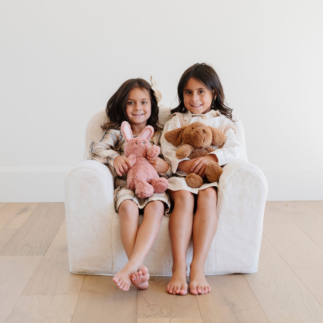 Encourage quiet time with the Cream Saranoni Snuggle Up Chair, a soft lounge chair for kids.
