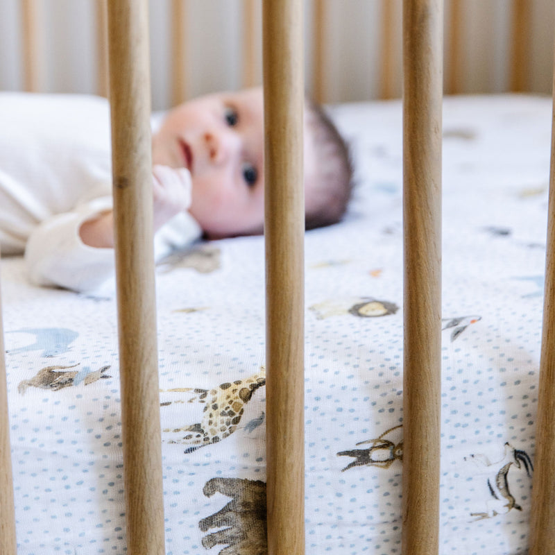 Charming Party Animals design on Little Unicorn Cotton Muslin Crib Sheet, crafted from organic cotton for the best crib sheets.