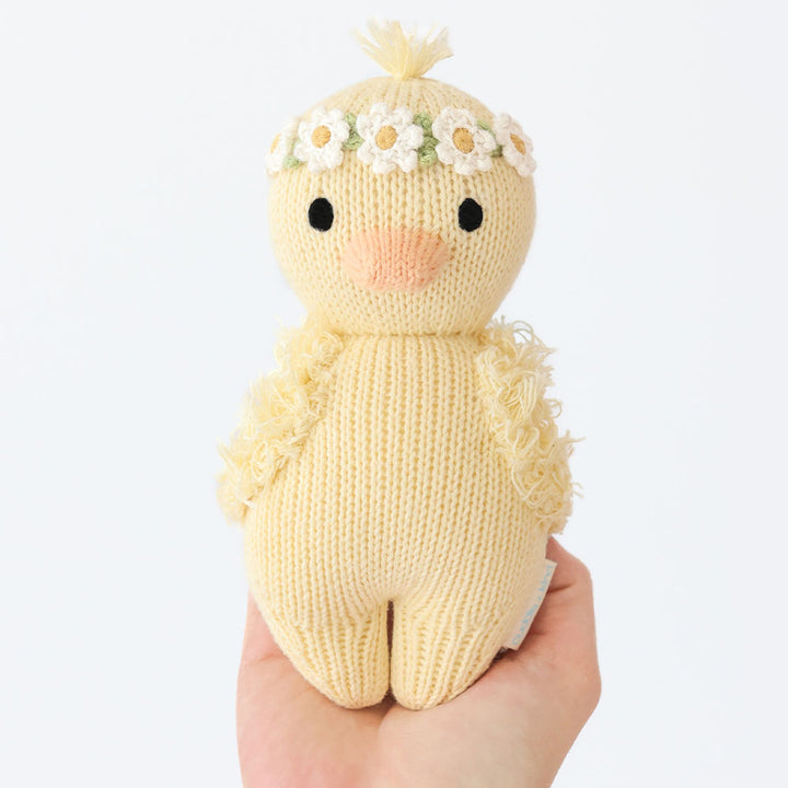 Fluffy and floral, the Cuddle + Kind Baby Duckling brings gentle charm to your stuff animal set