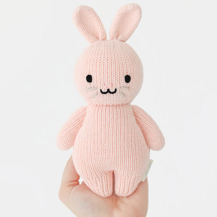Cuddle + Kind Rose Bunny shown sitting sweetly, a timeless pick for plushies enthusiasts
