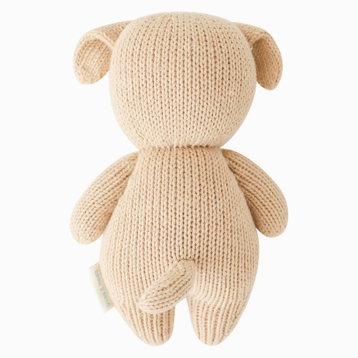 In warm tones, the Baby Puppy by Cuddle + Kind adds softness to any stuffies collection