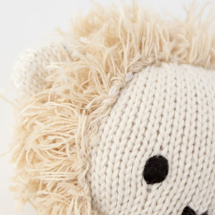 Cuddle + KindÕs Baby Lion shown seated, a classic choice among beloved stuff animals