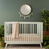Lifestyle image of Soho Crib in Sage in a nursery. Baby nursery furniture