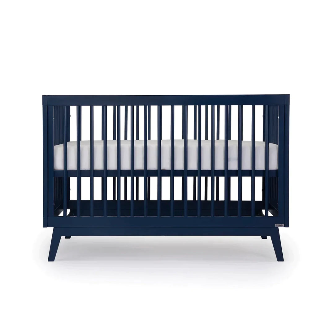 dadada Denim Soho 3-in-1 Convertible Crib to Toddler Bed Furniture. Navy blue in color. Showing a different height position
