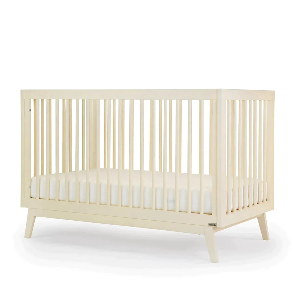 dadada Meringue Soho 3-in-1 Convertible Crib to Toddler Bed Furniture . Light creamy yellow in color. Baby room furniture