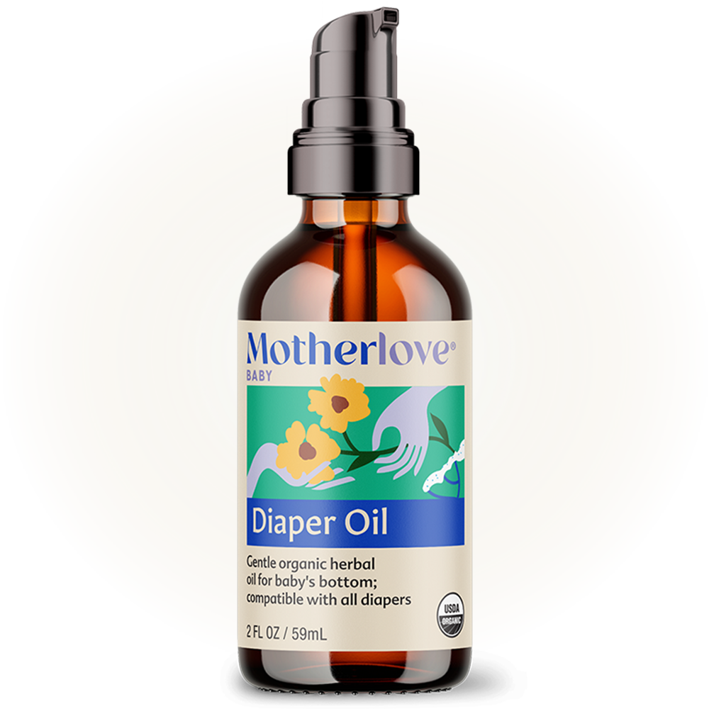 Soft light highlights Motherlove Diaper Oil bottle, crafted for calming and hydrating delicate baby oil skincare.