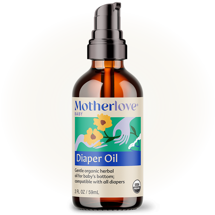 Soft light highlights Motherlove Diaper Oil bottle, crafted for calming and hydrating delicate baby oil skincare.