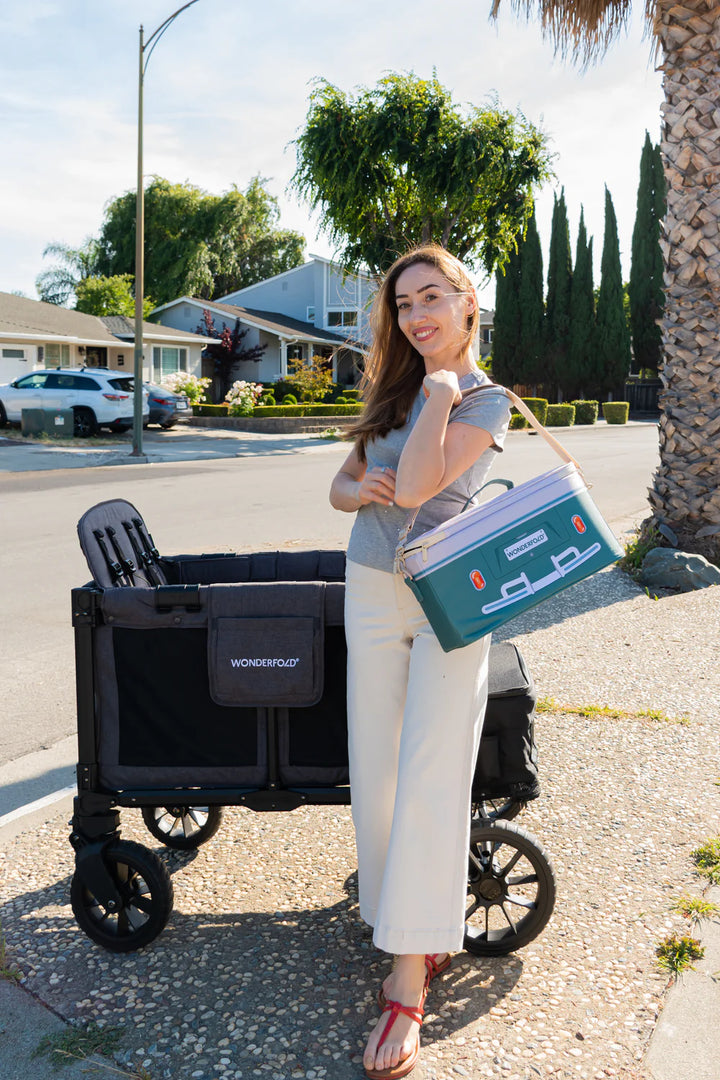 Parent carrying Wonderfold VW Cooler Bag in lifestyle view, showcasing the best cooler bag option for outings.