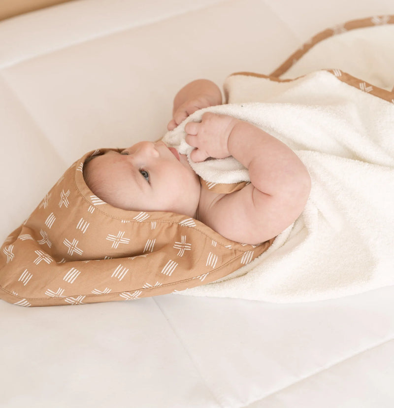 Luxurious Crane Baby Ezra Hooded Towel, a gentle baby bath towel perfect for nursery use and travel.