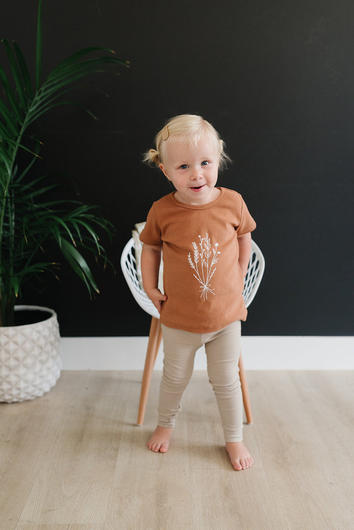 Oatmeal Organic Leggings paired with a matching bodysuit, a soft stretchy pants made for crawling babies.