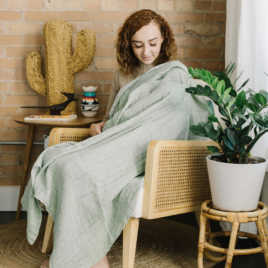 Soft and durable, the Little Unicorn Cotton Muslin Swaddle Blanket - Cactus Lines makes cozy muslin swaddle blankets for babies.