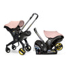 Doona Stroller shown as a car seat and stroller in the color Blush Pink
