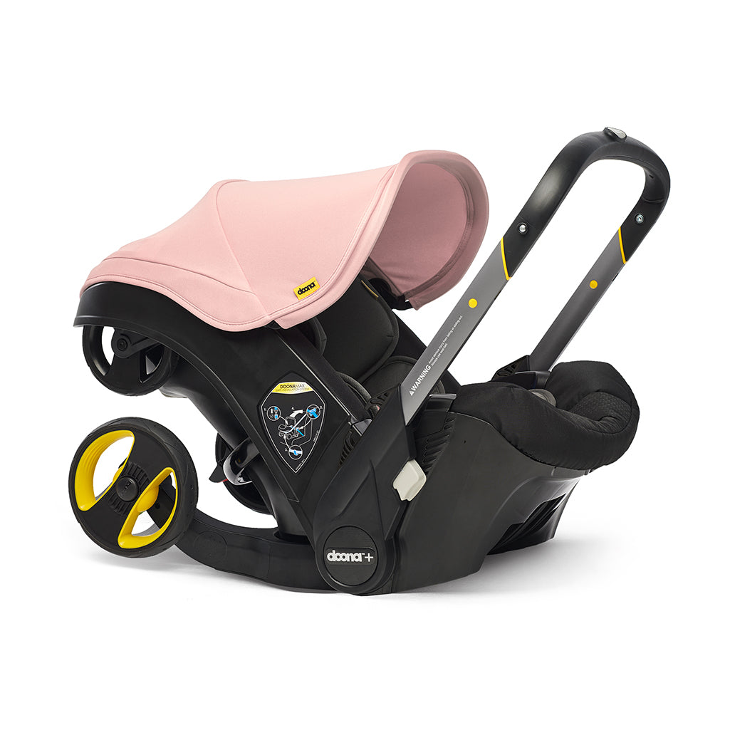 Blush pink infant carseat with doona stroller