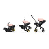 Transition of the Doona car seat to stroller in the color blush pink