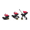Doona car seat transitioning to the stroller mode in the color Flame Red
