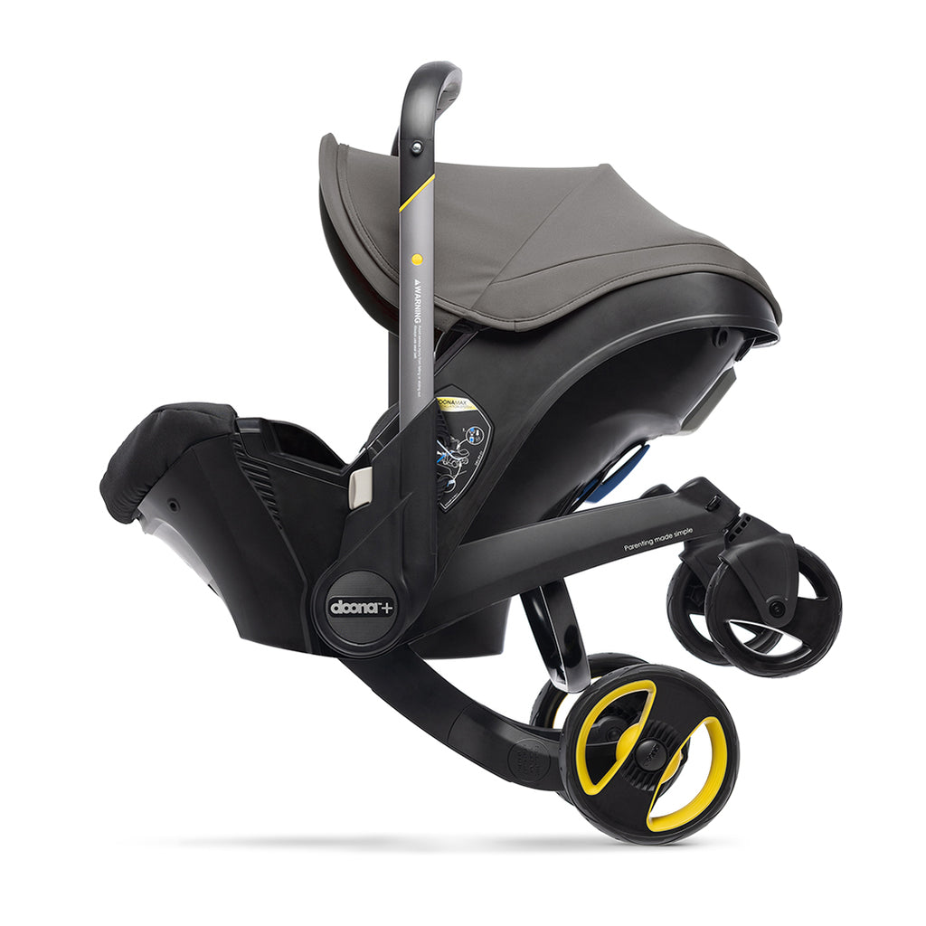 Doona Car seat Transitioning to Stroller mode in the color grey hound