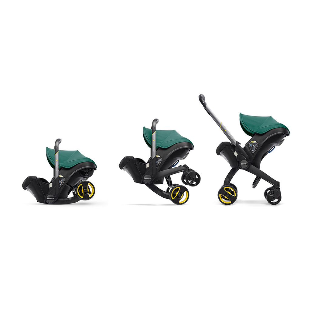 Transitioning from a car seat to a Doona Stroller in Racing Green color