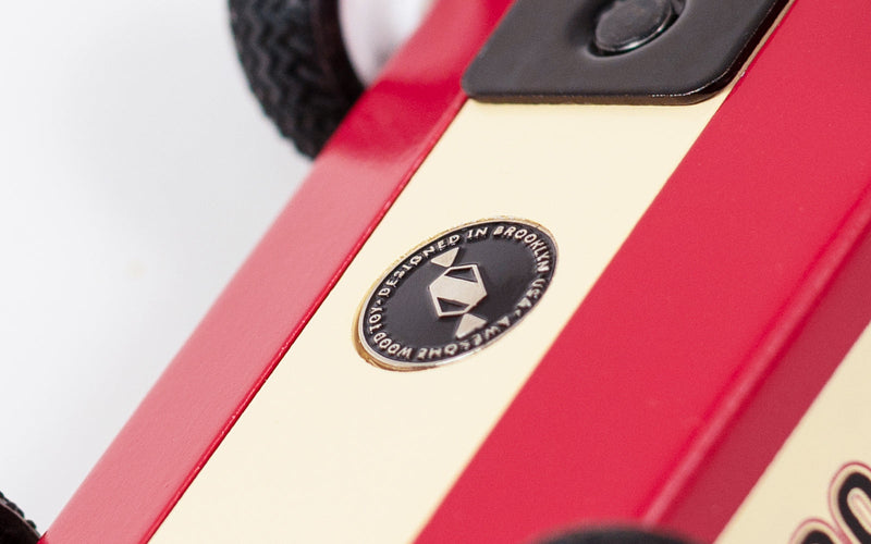 Close-up detailing of the Plantoys Drifter Nigel highlights smooth curves and craftsmanship, perfect for wooden toy car shoppers.