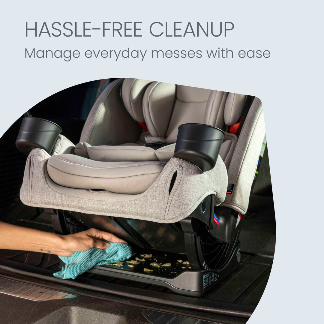 Wiping down the Britax One4Life Slim all-in-one car seat in Parchment for hassle-free cleanup