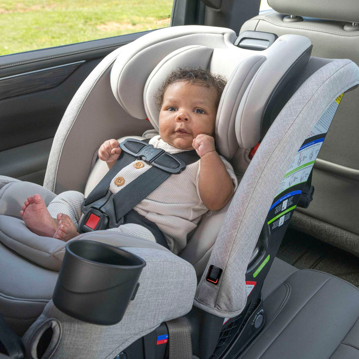 Infant riding rear-facing in the Britax One4Life Slim convertible car seat in Parchment
