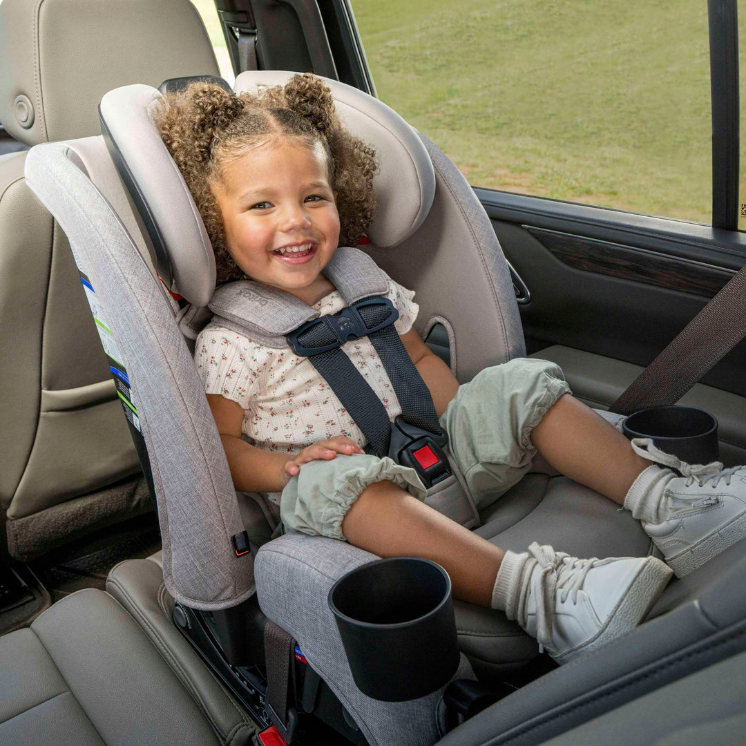 Toddler smiling in the Britax One4Life Slim all-in-one car seat, forward-facing in Parchment
