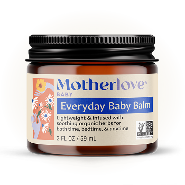 Close-up of Motherlove Everyday Baby Balm jar, crafted from organic ingredients for gentle and nourishing skin balm care.