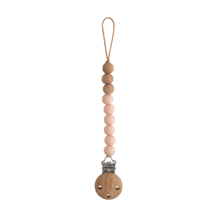 Mushie Eva Pacifier Holder in Blush the perfect choice for fashionable and functional pacifier storage