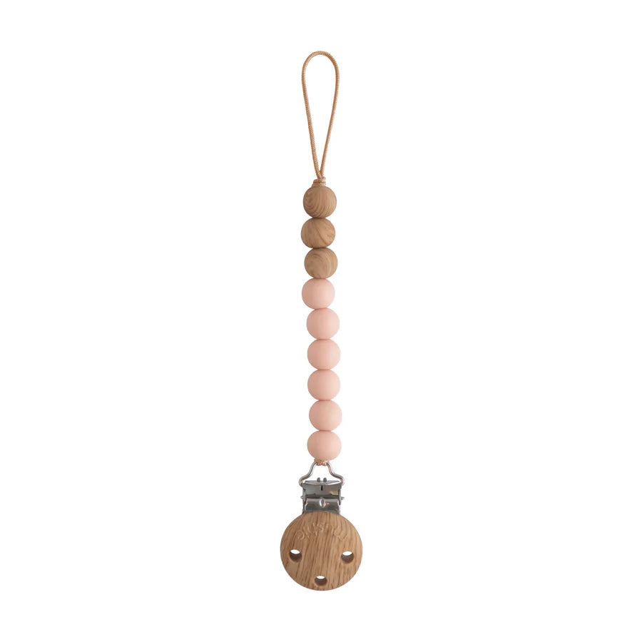 Mushie Eva pacifier holder in Blush