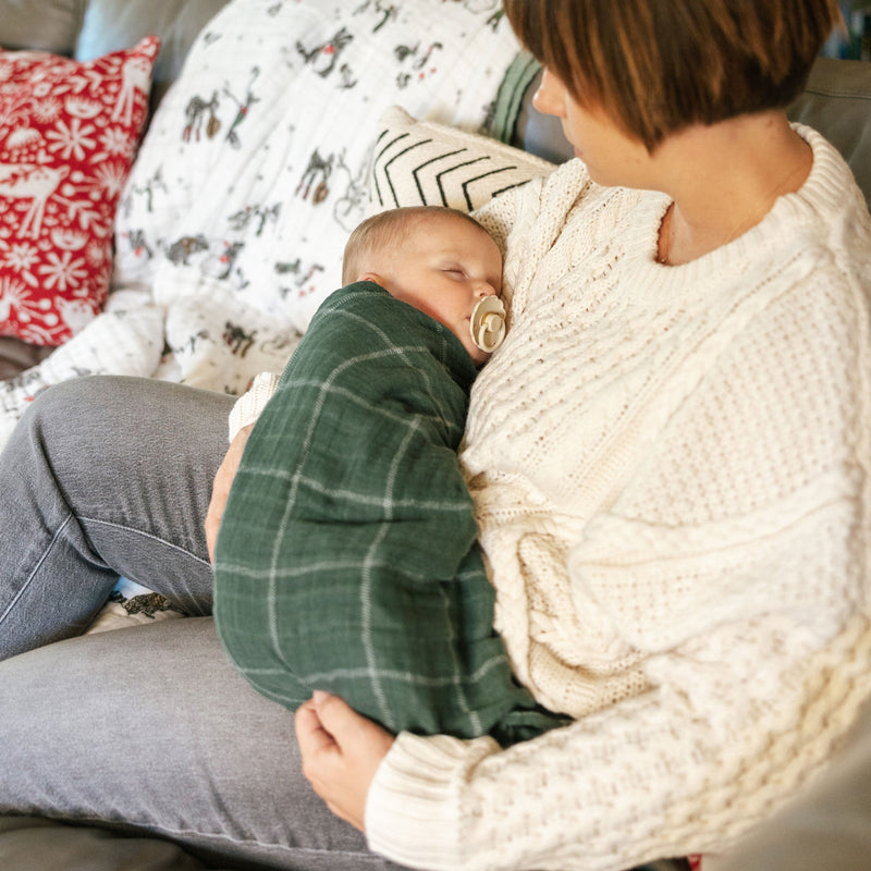 Soft Evergreen Plaid muslin baby blankets by Little Unicorn, perfect for nap time and cuddles.