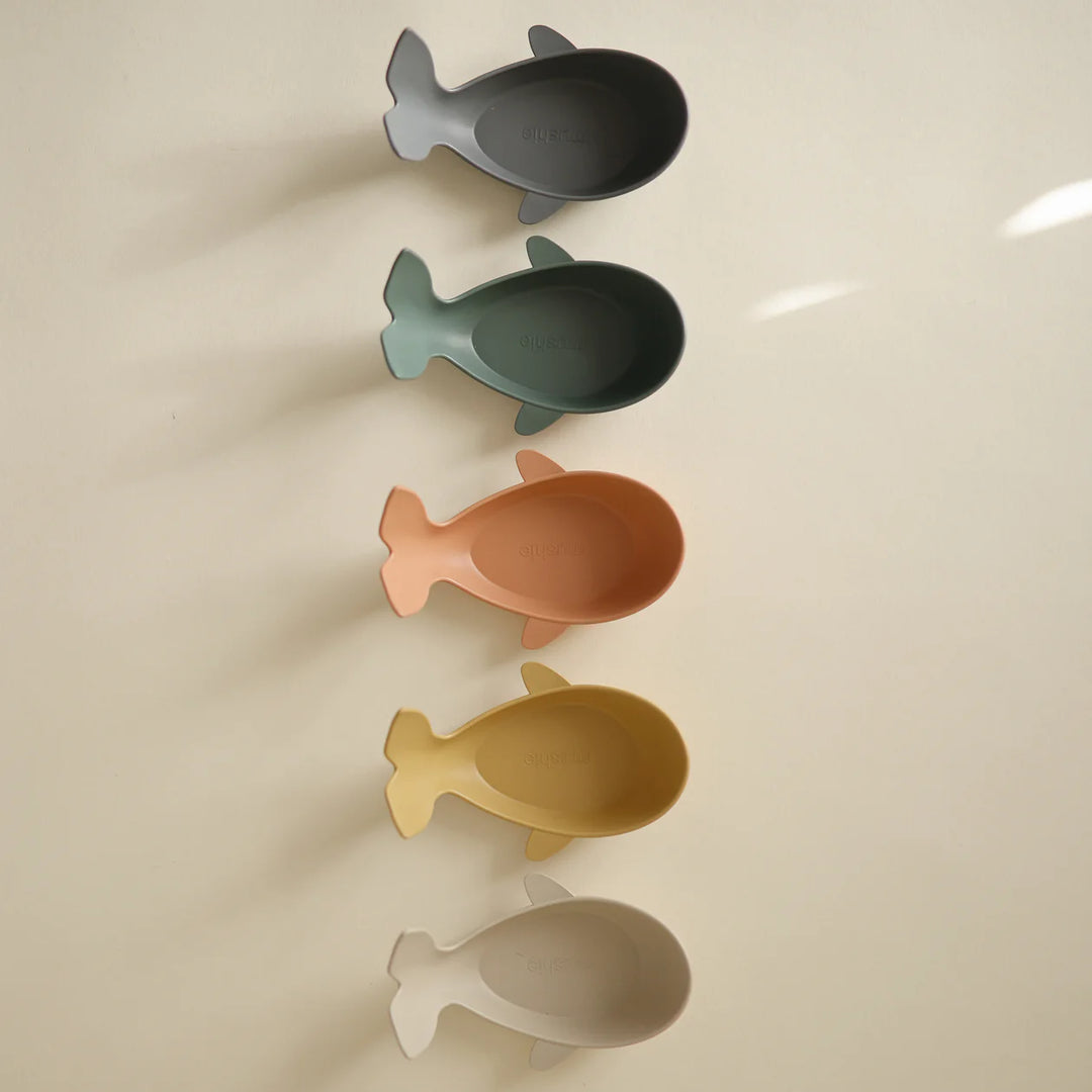 Mushie Retro Whale Bath Stackers flat lay - retro-toned silicone stacking cups displayed on neutral background