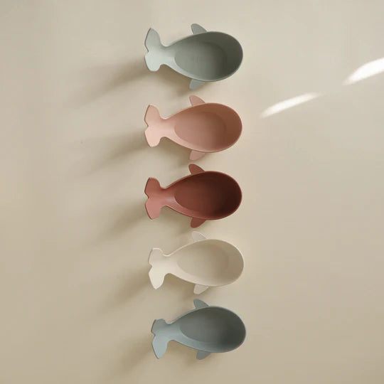 Mushie Original Whale Bath Stackers product flat lay - soft-toned silicone whale cups on neutral background