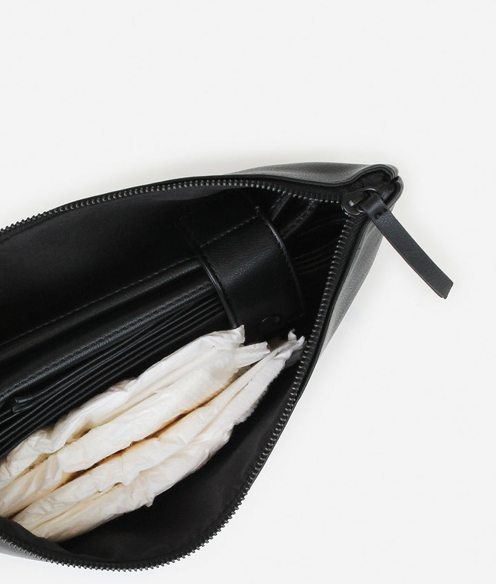 Inside of the Fawn Design Changing Clutch Bag in Black with Black Logo and details Includes a matching diaper changing mat to accompany the diaper bag