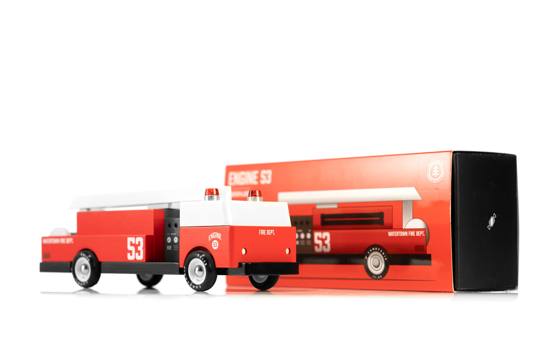 The Plantoys Ladder 53 Fire Truck packaging is displayed cleanly, offering a durable wooden toy car ideal for imaginative rescue play.