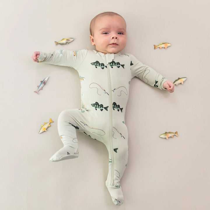 Little ones drift off in the Fishing Kyte Baby Zippered Footie warm footie pajamas style.
