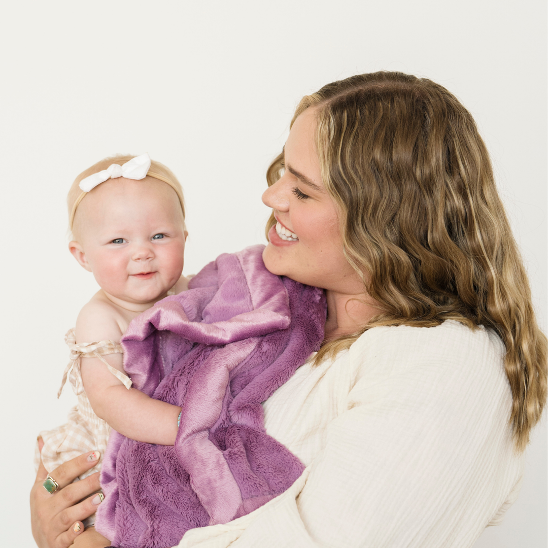 Ultra-plush Aubergine Lush Receiving Blanket from Saranoni keeps toddlers comfy as a top baby boy blankets.