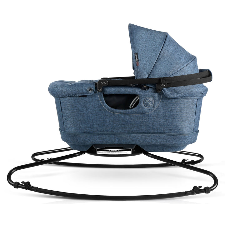 A front angle of the Orbit Baby G5 Travel Bassinet Melange Navy displays its graceful lines and newborn rocking bassinet charm.