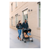 parents strolling with uppababy g-link double stroller