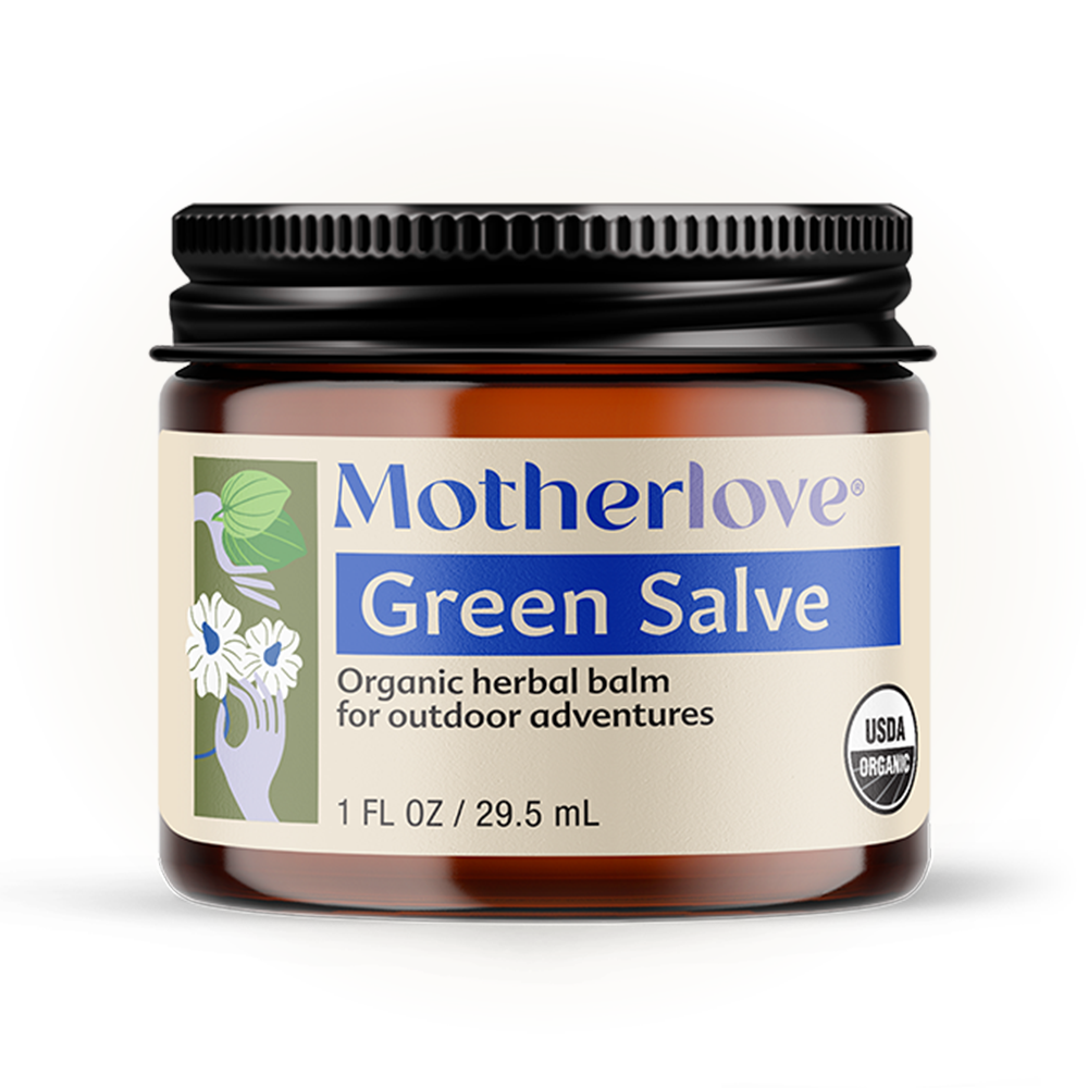 Soft light highlights Motherlove Green Salve, a nourishing skin balm that calms and hydrates dry, irritated skin.
