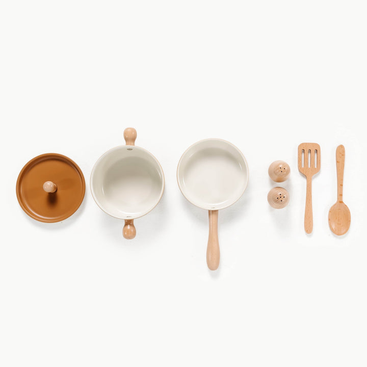 Seven piece play cooking set from Gathre includes a stock pot, pan, spatula, spoon, and shakers