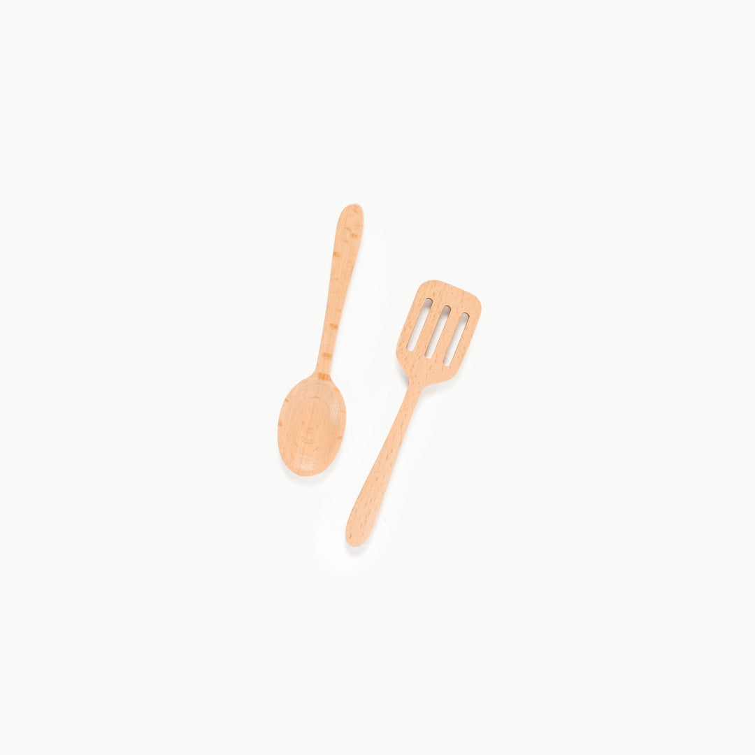 Wooden play spatula and spoon crossed together from Gathre's pretend kitchen set