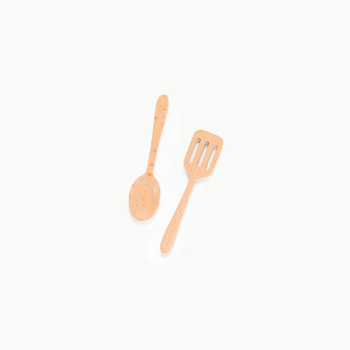 Wooden play spatula and spoon crossed together from Gathre's pretend kitchen set