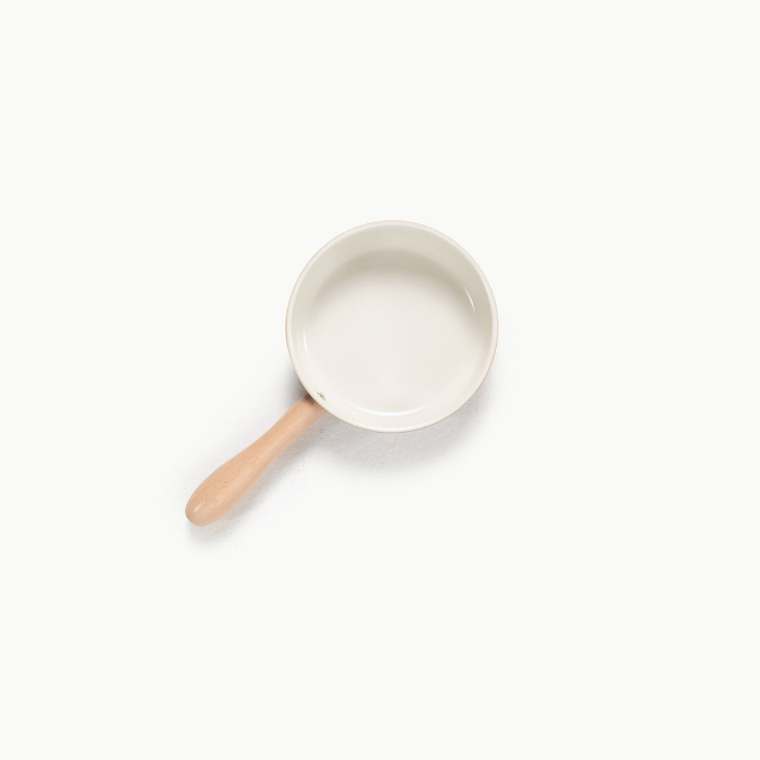 Play cooking pan shown alone from above, a metal piece in Gathre's kitchen playset