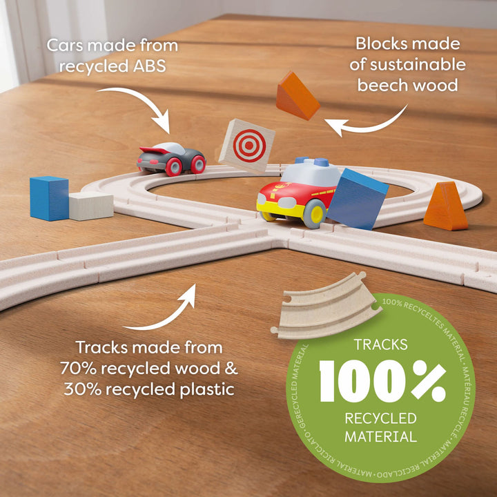 Toddlers explore speed and coordination through HABA Cars - My First Racetrack, an educational wood toy.