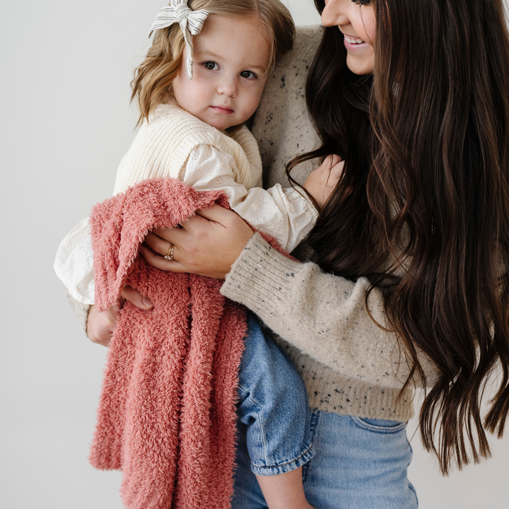 Vibrant and plush, the Saranoni BAMBONI¨ Mini Blanket in Hibiscus is the best baby blanket for cheerful snuggles.